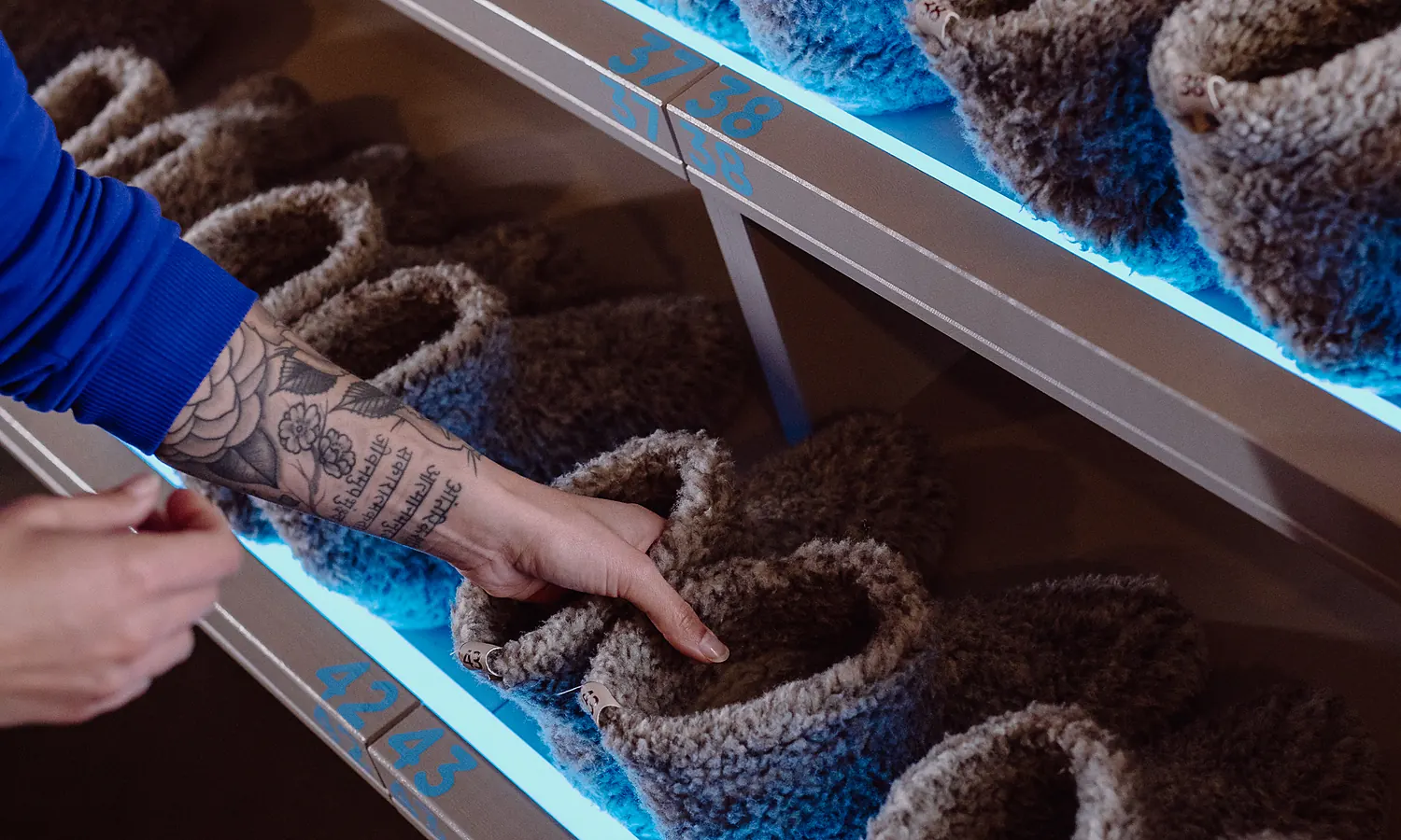 Freezlab slippers on the lit rack at reception